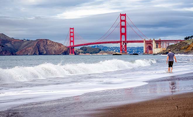 A photo of a gay man on Baker Beach, San Francisco.