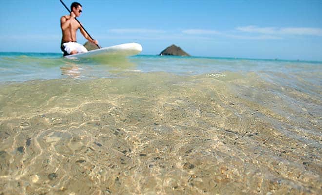 A photo of a gay man at Little Beach, Hawaii.