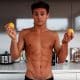 This is a photo of Tom Daley preparing a glass of lemon water.
