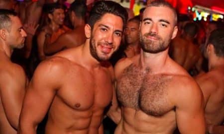 This is a photo of a gay couple at a bar.