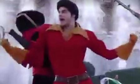 This is a photo of Gaston dancing in a Disney theme park.