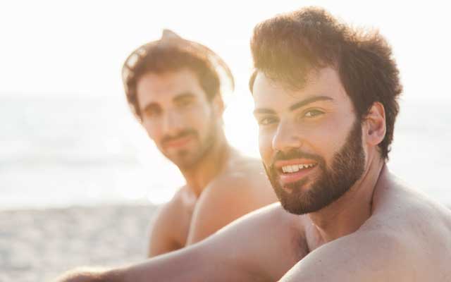 Gay boyfriends on the beach.