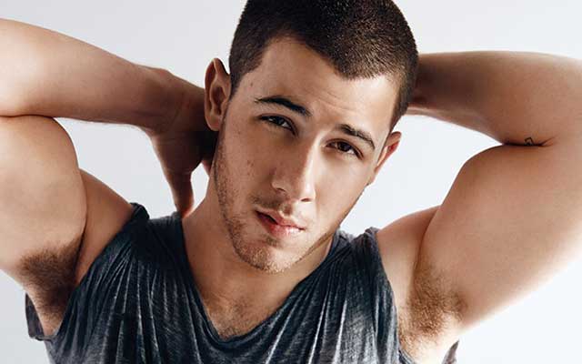 This is a photo of Nick Jonas from 'OUT Magazine'.