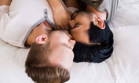A gay couple in bed.