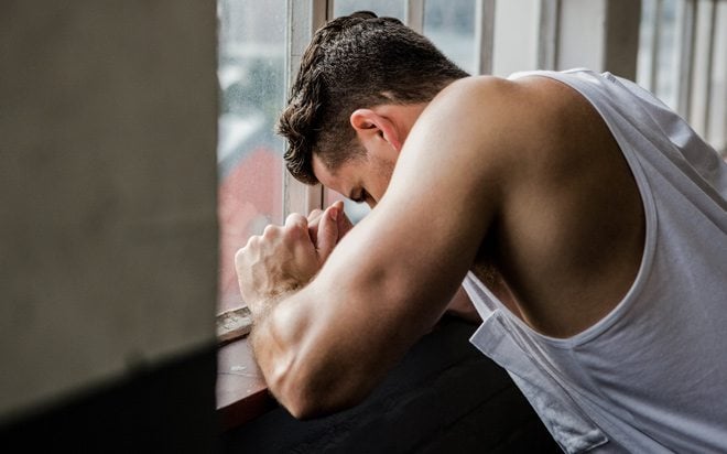 Man looking out the window