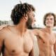 Gay couple walking on the beach