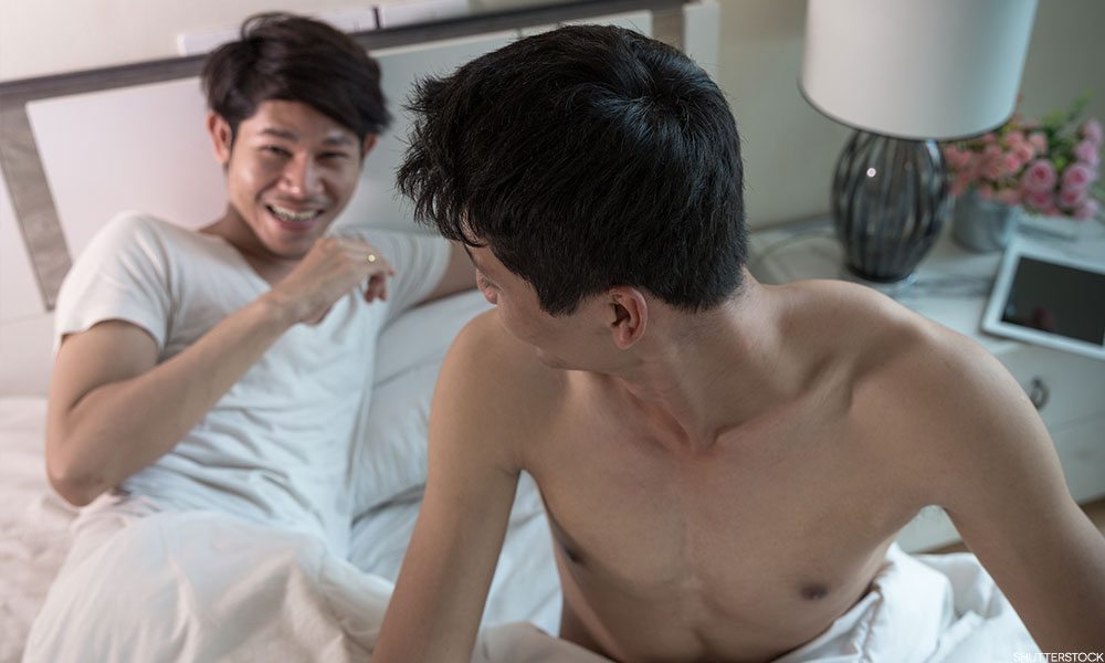 A gay chinese couple in bed.