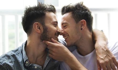 Bisexual male couple at home
