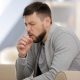 Young man coughing