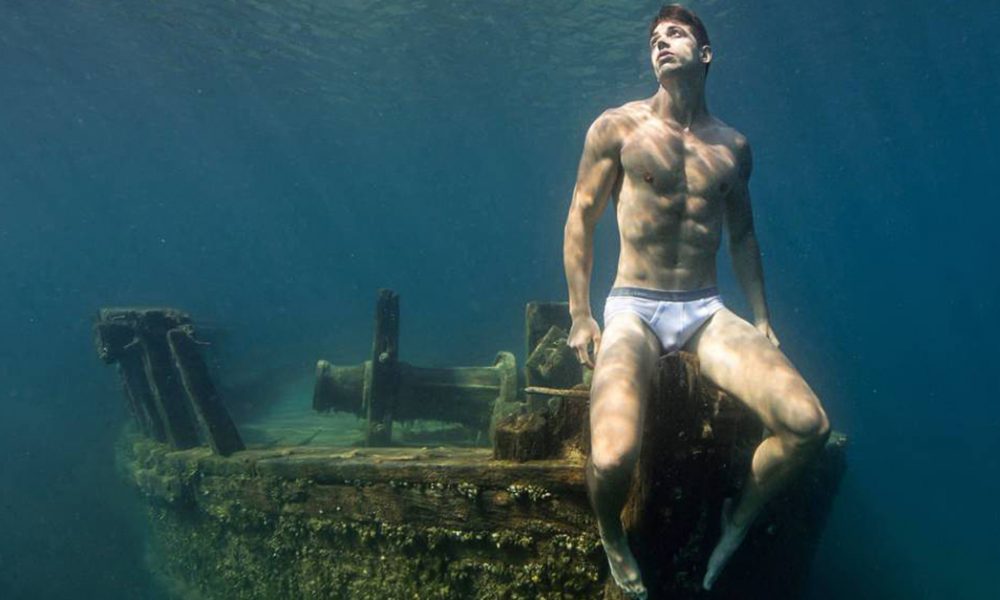 A photo of a male model underwater by Lucas Murnaghan