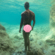 A photo of a male model underwater by Lucas Murnaghan