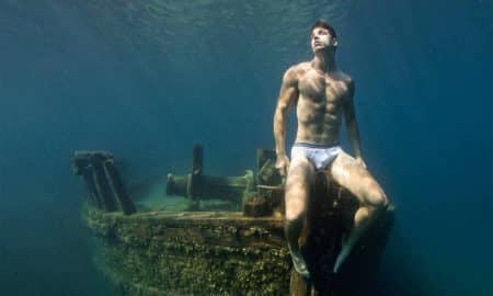 A photo of a male model underwater by Lucas Murnaghan