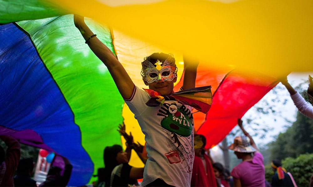 A boy dances as he and others participate during the 4th Delhi Queer Pride
