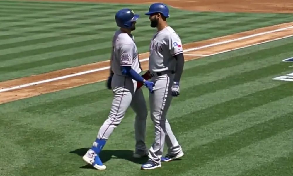 Baseball Players Celebrate Home Run With Frisky Handshake
