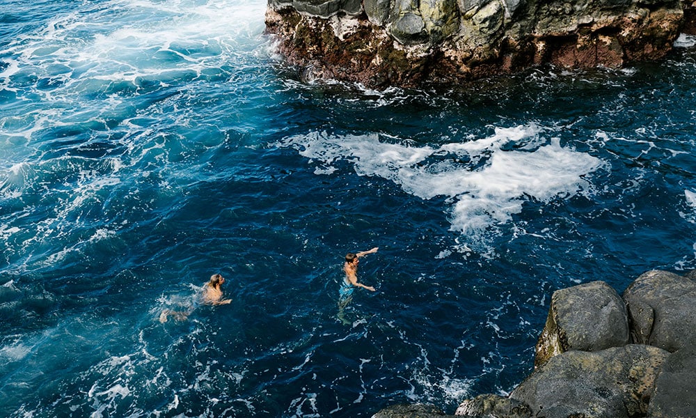 Two men swimming Kauai