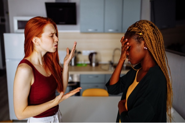 female couple arguing in kitchen