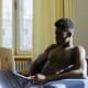 Shirtless man on laptop
