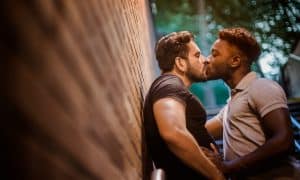 Two Men Kissing in Subway