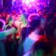 Gay party, great dance floor Unfocused image with people dancing in a gay dance floor full of colors.