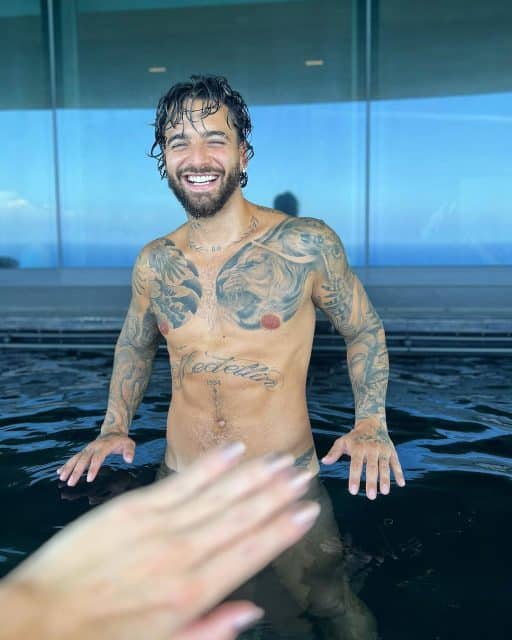 Maluma Flaunts His Toned Physique in Revealing Pool Photos