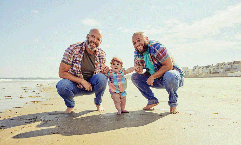 Gay dads with their child