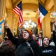 Hundreds of Iowa residents gathered at the state Capitol Thursday, waving Pride flags in protest of a controversial bill that seeks to remove gender identity as a protected class under Iowa’s Civil Rights Act.