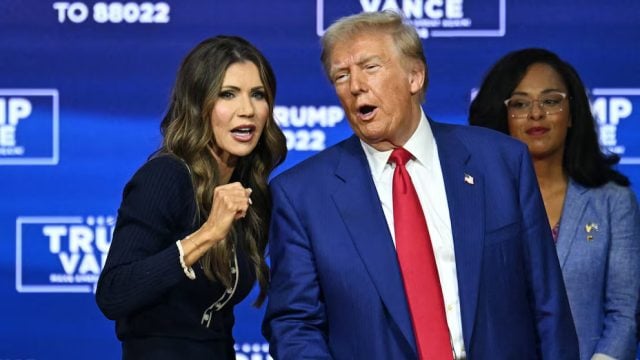 Kristi Noem with Donald Trump.